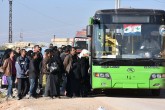 تصاویر/ انتقال تروریست‌ها از حلب با عکس های اسد  <img src="/images/picture_icon.gif" width="16" height="13" border="0" align="top">